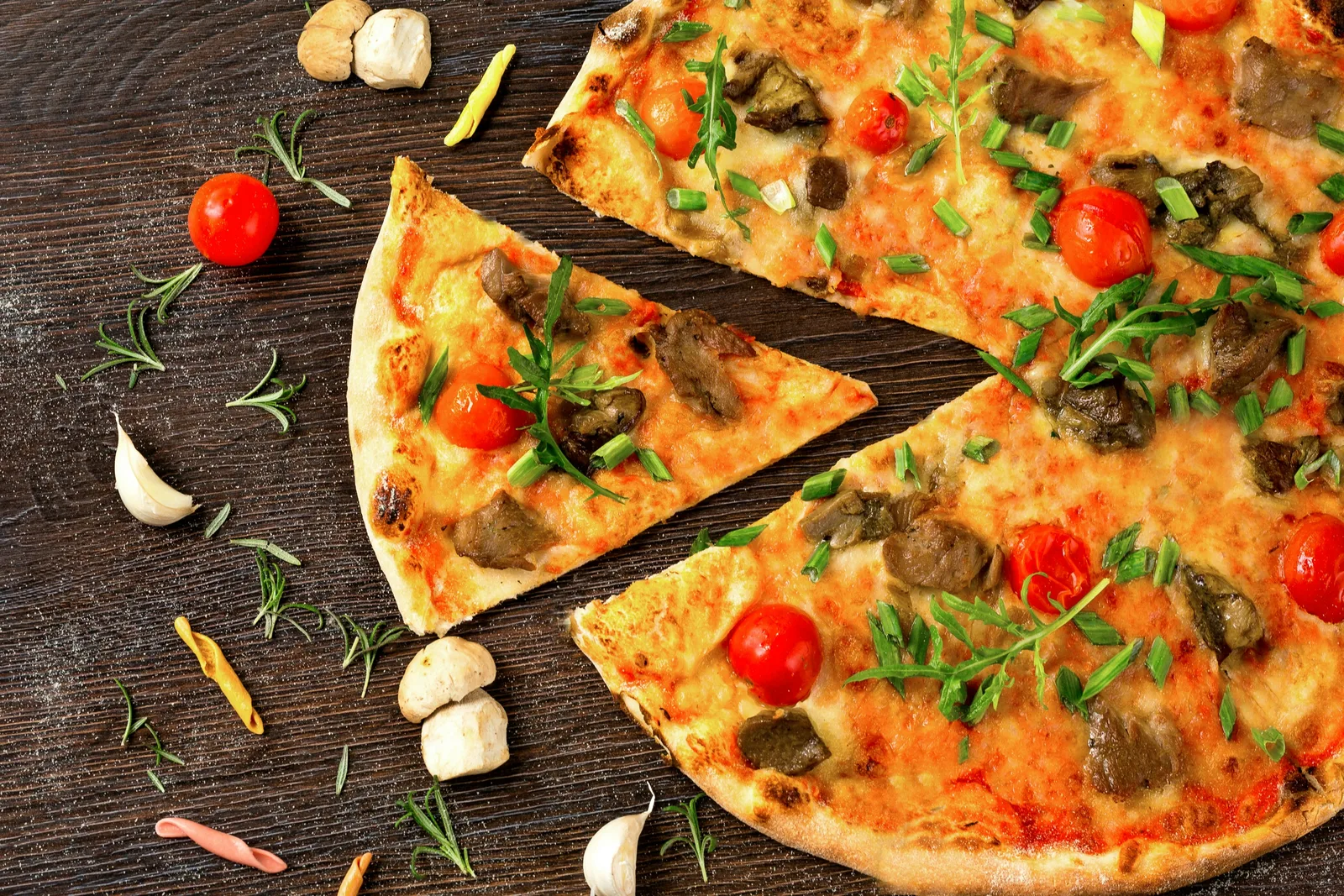 A slice of Smoke & Sizzle3 signature pizza